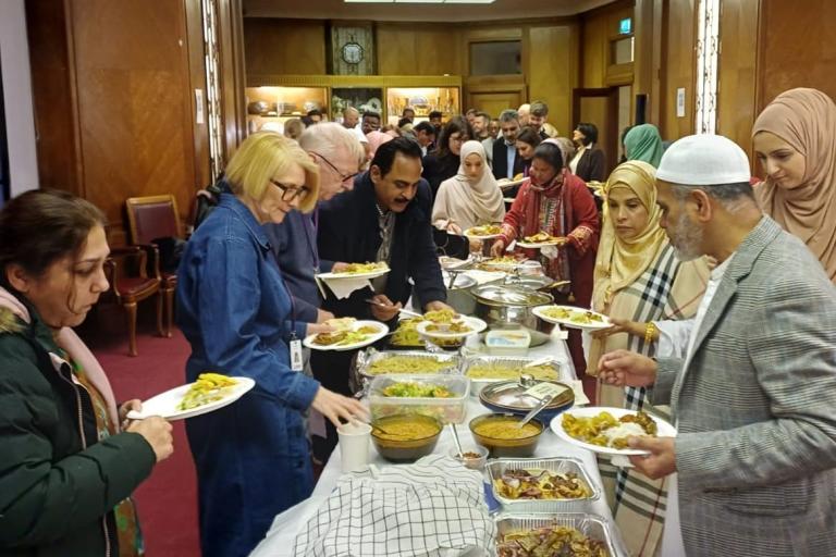 Council staff taking part in Iftar meal at the Town Hall
