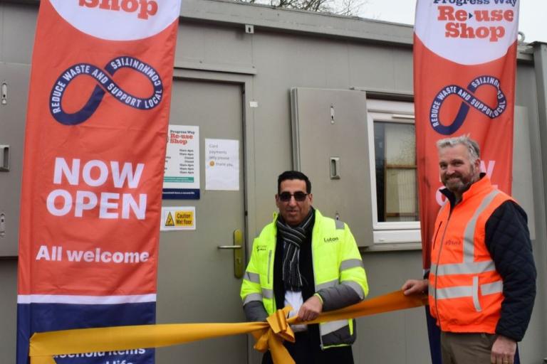 Cllr Ghulam Abbas cutting ribbon at the launch of tidy tip reuse shop. 