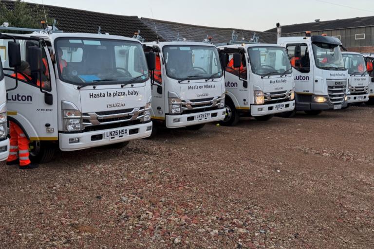new food waste vehicles lined up. 