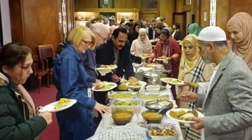 Council staff taking part in Iftar meal at the Town Hall