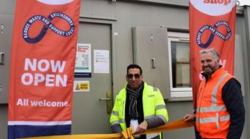 Cllr Ghulam Abbas cutting ribbon at the launch of tidy tip reuse shop. 