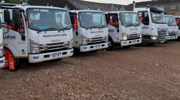 new food waste vehicles lined up. 