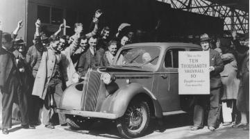Archival image of Vauxhall staff with car